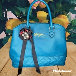Betsey Johnson purse in teal with red and black rose details and gold hardware